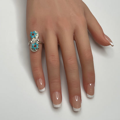 Sterling silver turquoise flower ring on hand, pinky fit with double floral design