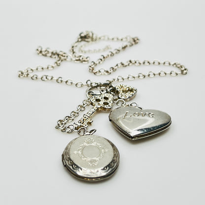 Sterling silver charm necklace with heart and oval lockets