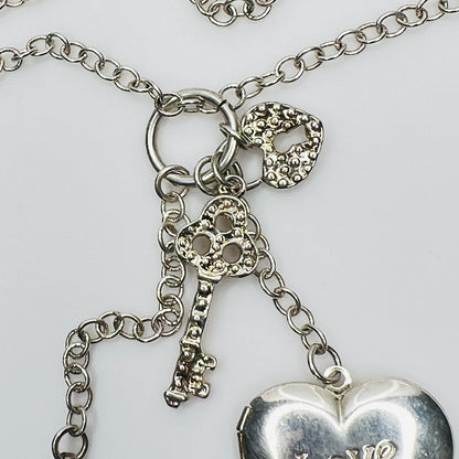 1990s silver charm necklace with key and lock details