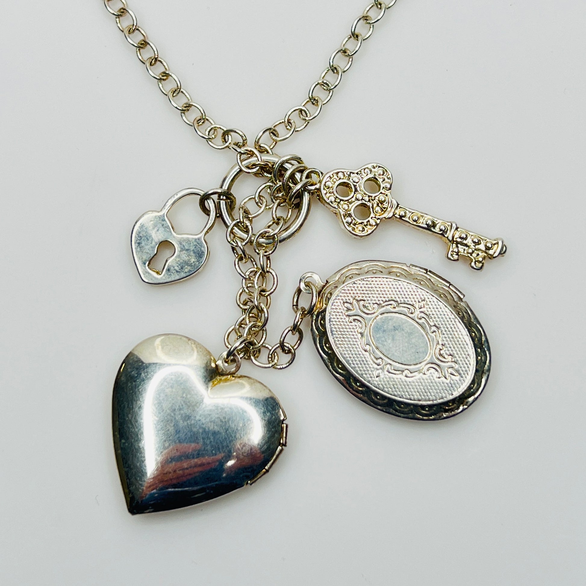 1990s silver charm necklace with key and lock details