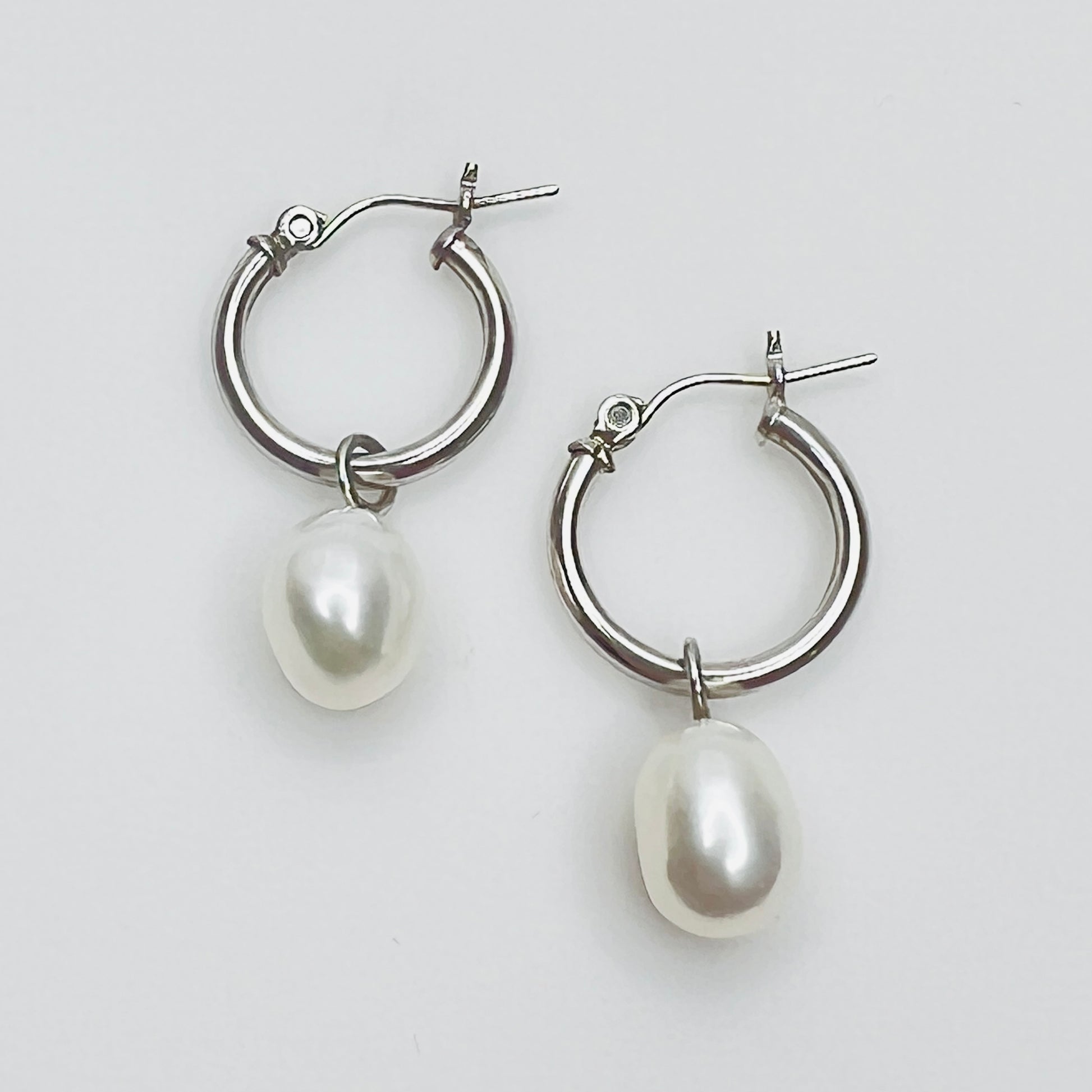 Sterling silver hoop earrings with pearl dangles