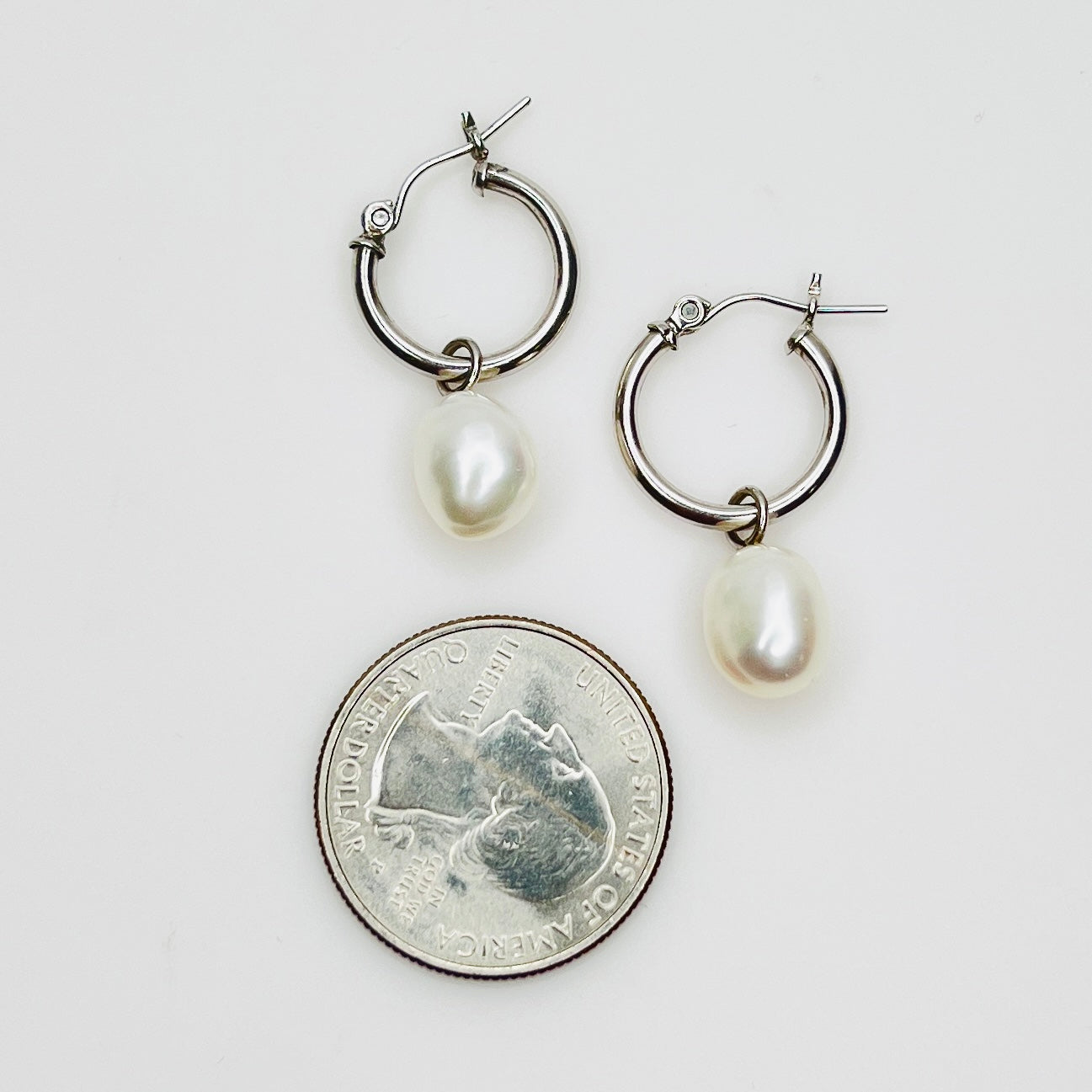 Sterling silver hoop earrings with pearl dangles