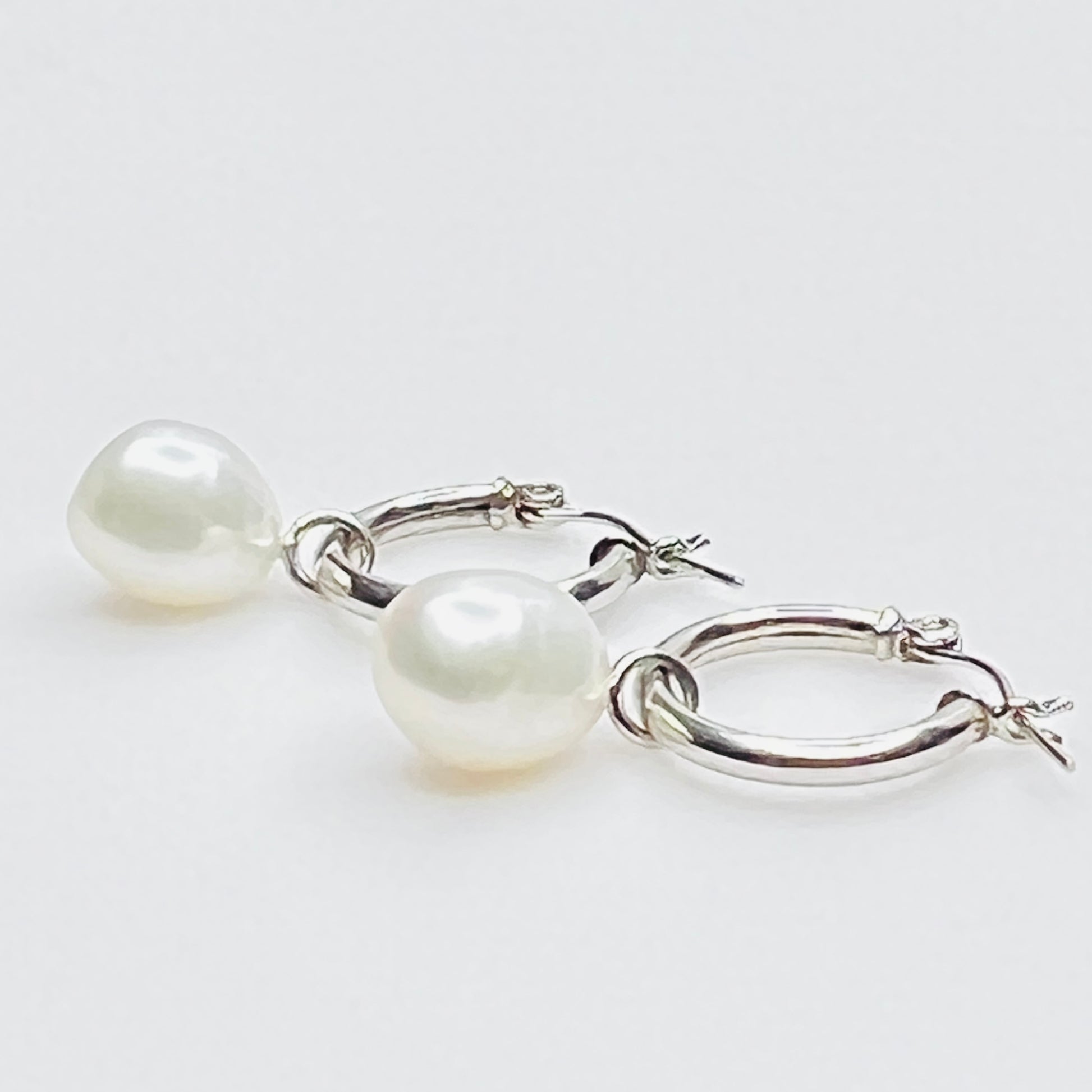Side view of sterling hoop with removable pearl drop