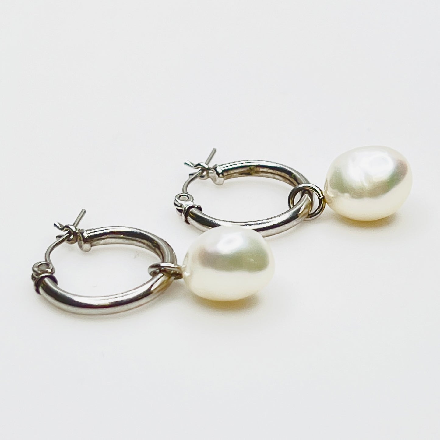 Side view of sterling hoop with removable pearl drop
