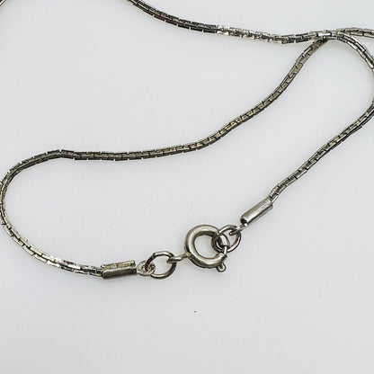 Close-up of spring ring clasp on non-sterling box chain