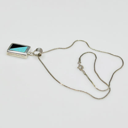 Full view of geometric inlay pendant on chain
