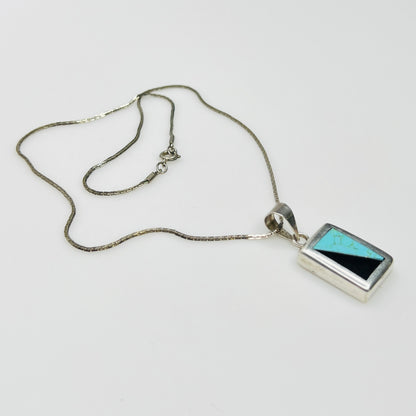 Full view of geometric inlay pendant on chain