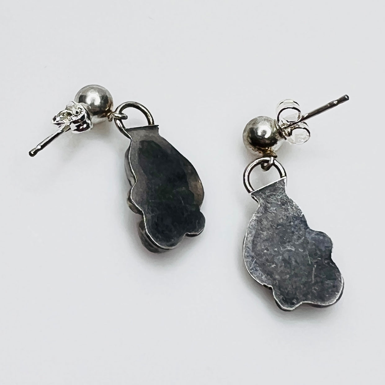 Back of sterling silver dangle earrings with 925 backs