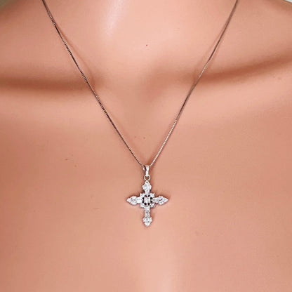 Sterling silver CZ cross necklace worn on mannequin