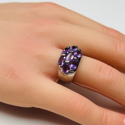 1970s amethyst statement ring with thick band on finger