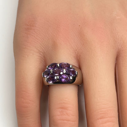 1970s amethyst statement ring with thick band on finger