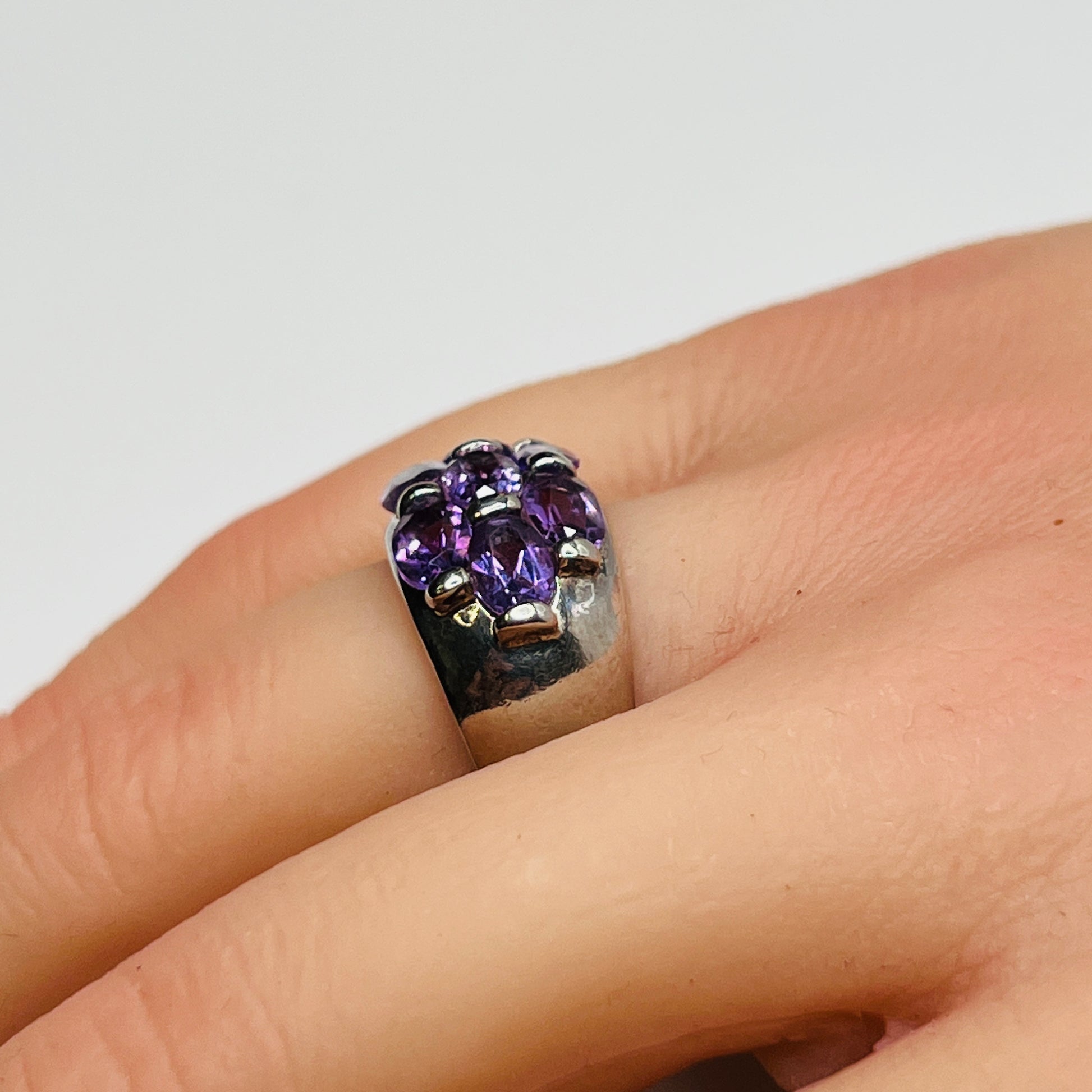 1970s amethyst statement ring with thick band on finger