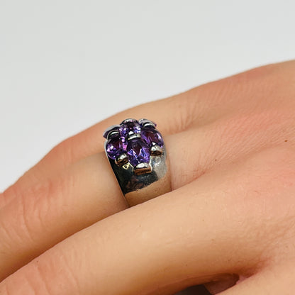 1970s amethyst statement ring with thick band on finger