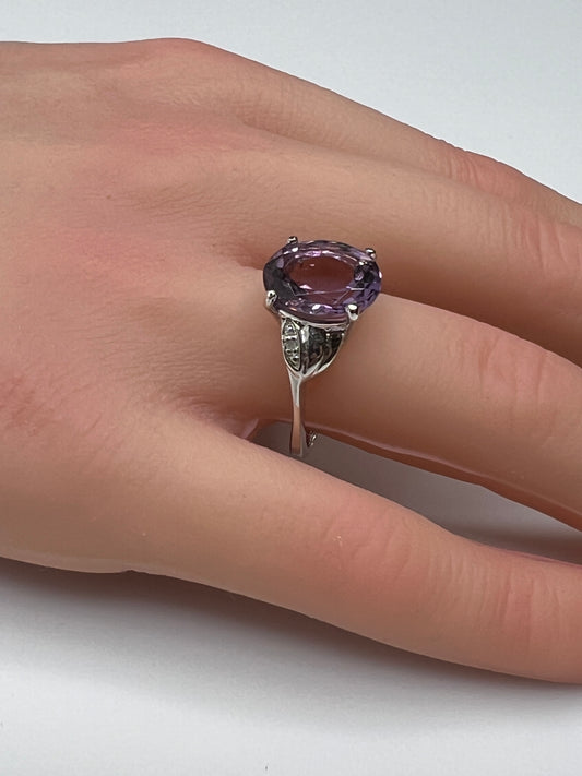 Vintage sterling silver ring with oval purple amethyst and diamond accents