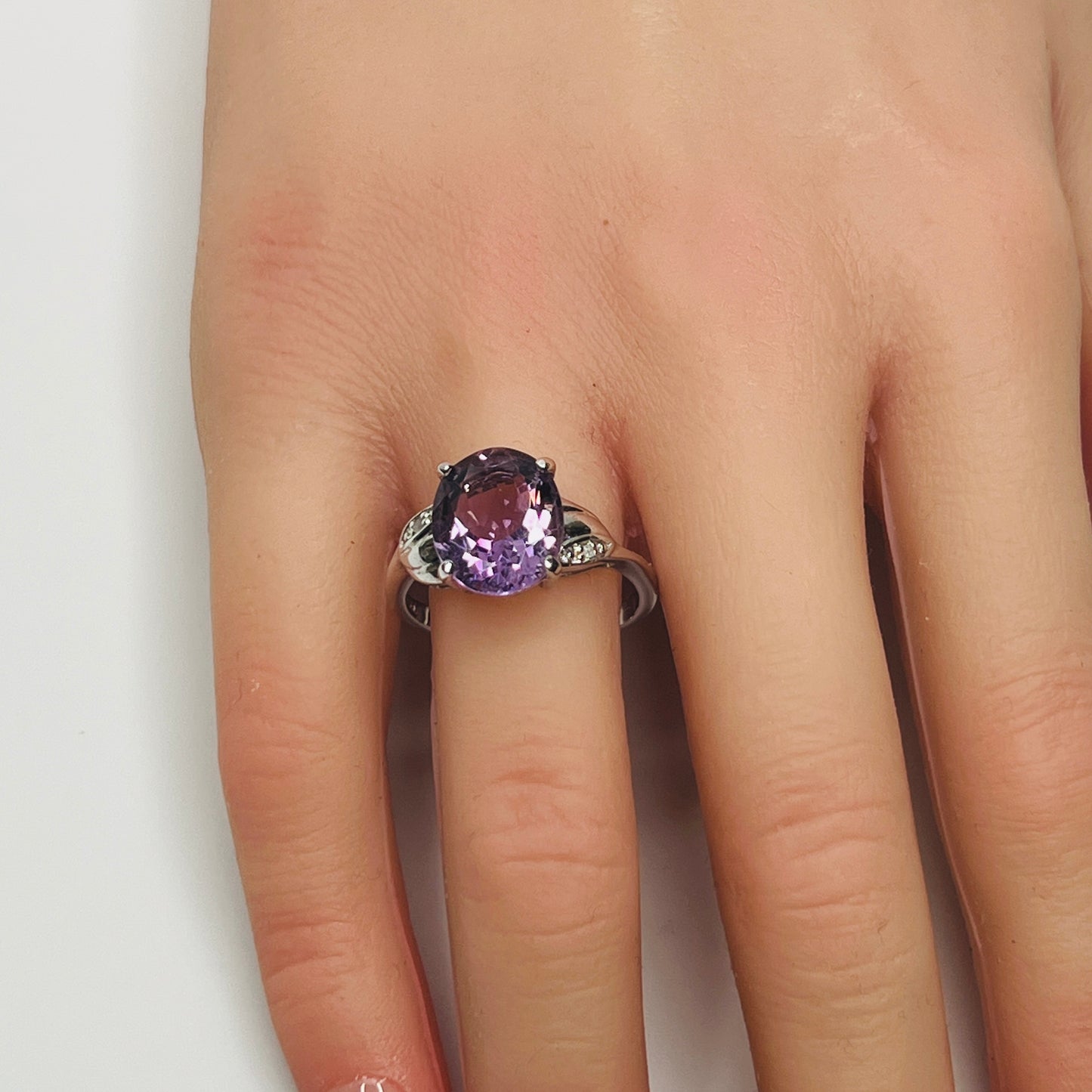 Vintage sterling silver ring with oval purple amethyst and diamond accents