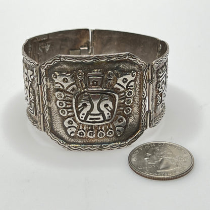 Close-up of center panel with sun deity motif and oxidized detailing