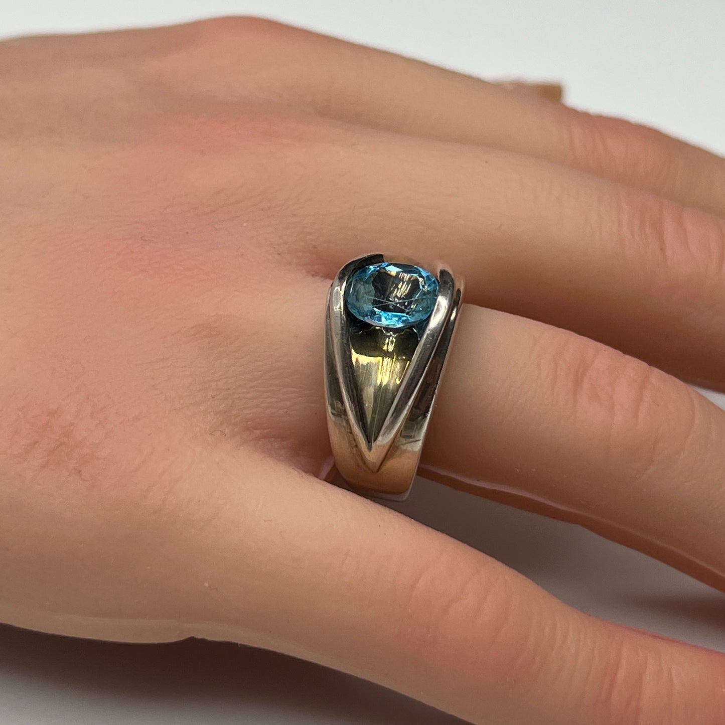 Vintage silver statement ring on hand with modernist design