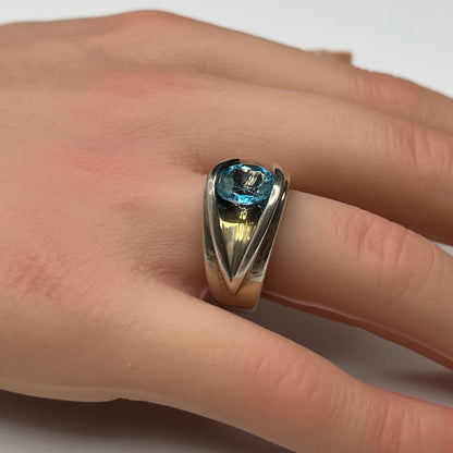 Vintage silver statement ring on hand with modernist design