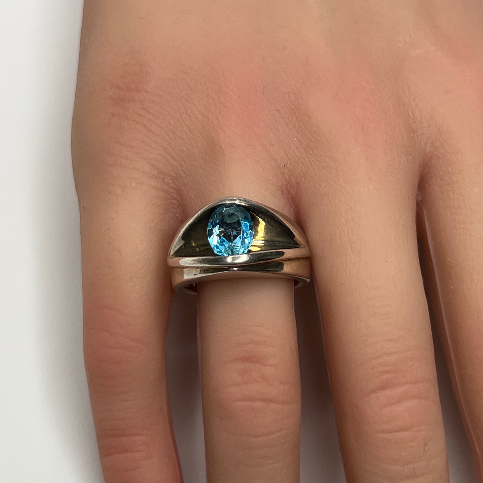 Vintage silver statement ring on hand with modernist design