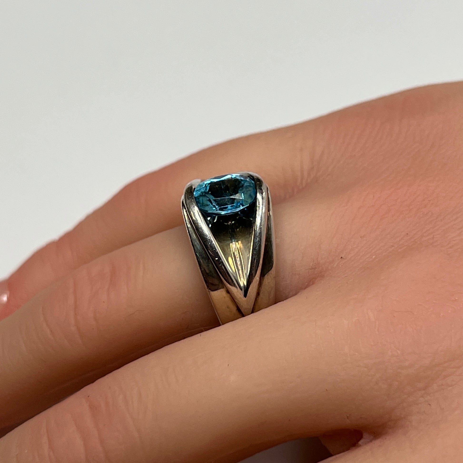 Vintage silver statement ring on hand with modernist design