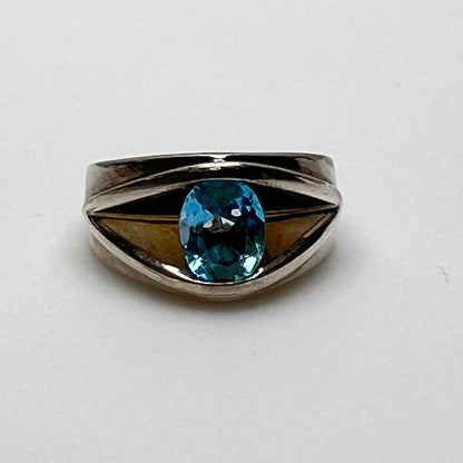 Heavy sterling silver ring with oval blue topaz, front view