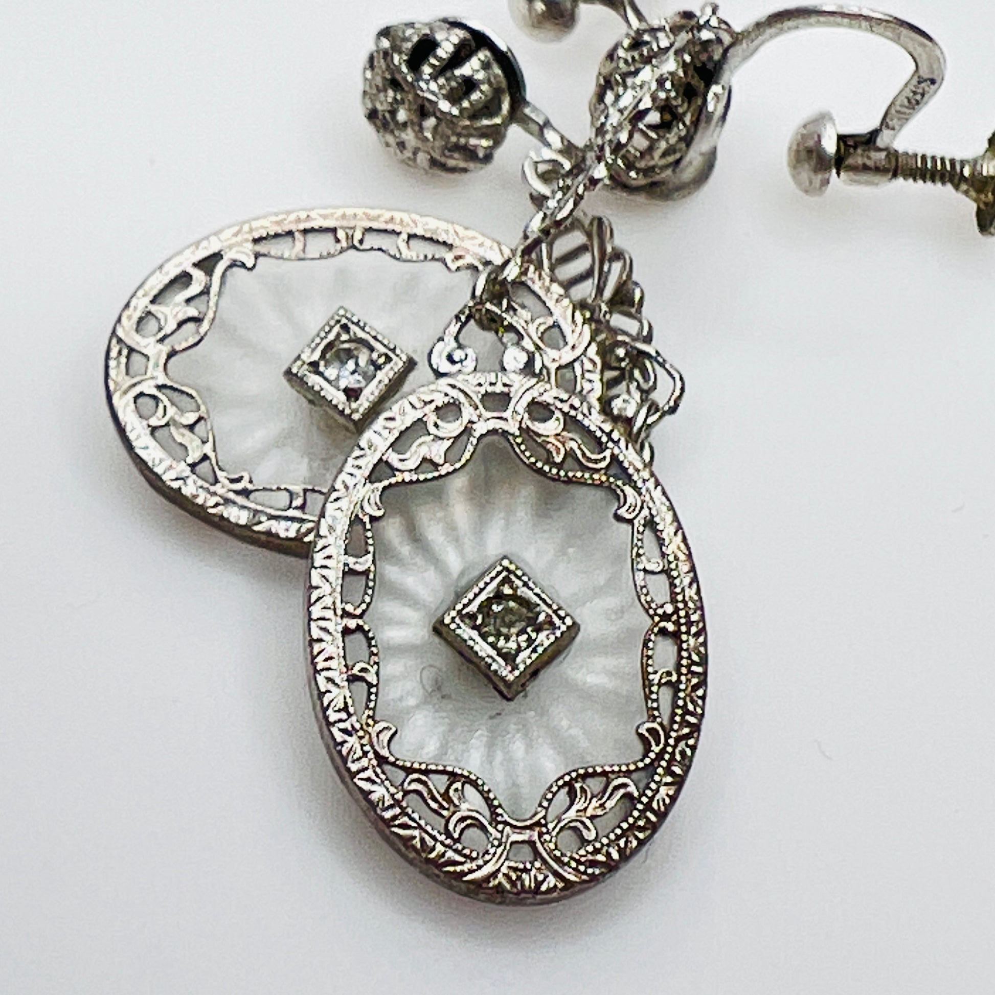 Sterling camphor glass dangle earrings with rhinestone center and filigree frame
