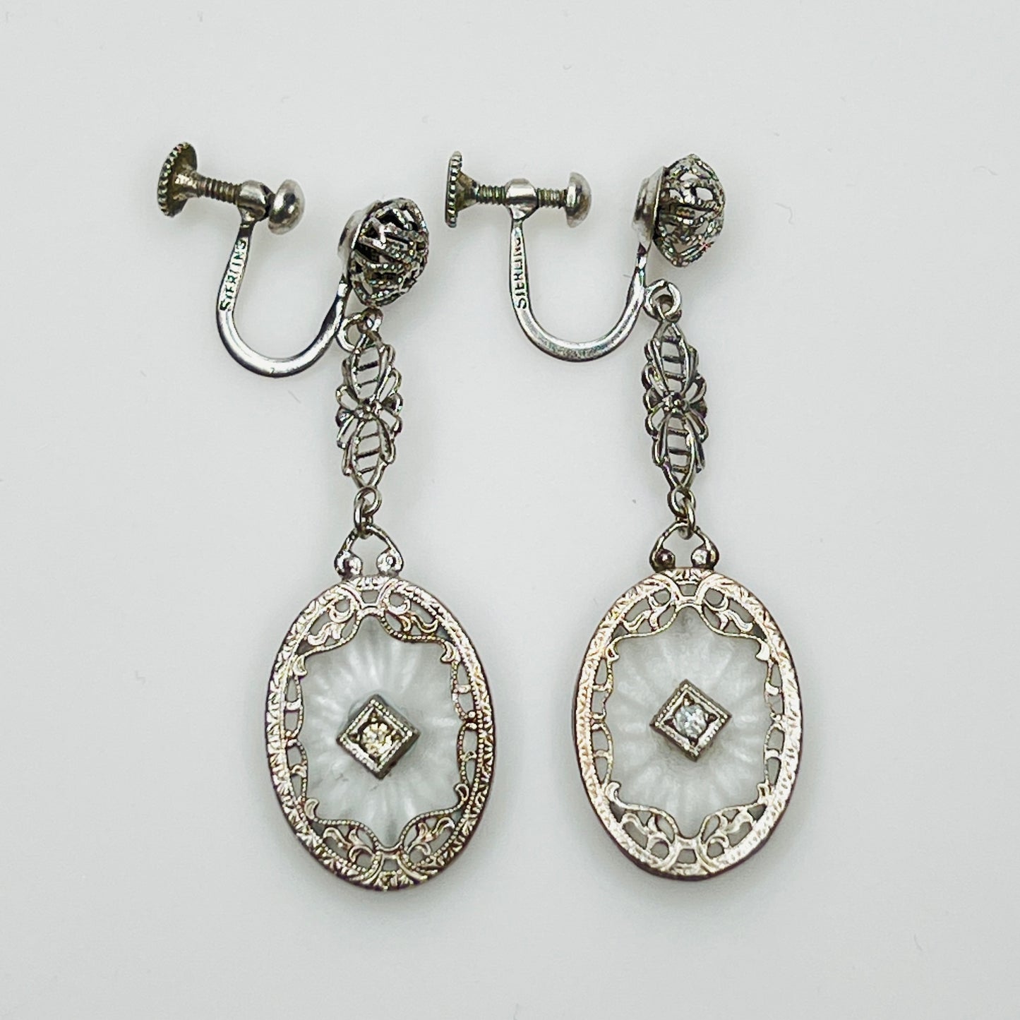Full view of Art Deco style earrings with screw back design