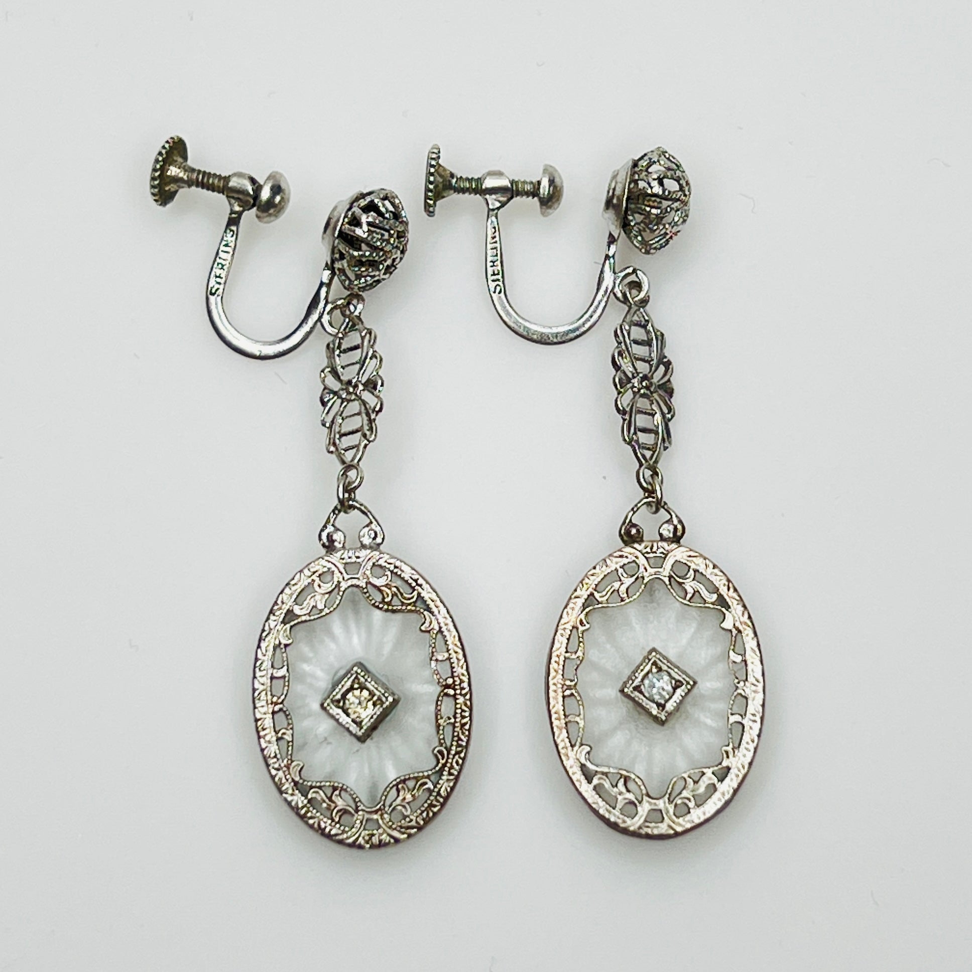 Full view of Art Deco style earrings with screw back design