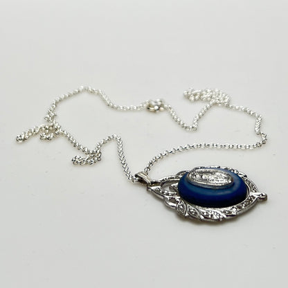 Close-up of marcasite Virgin Mary pendant with mother of pearl center