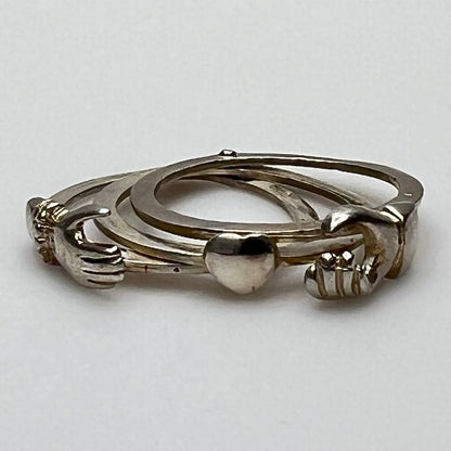 Open view of 3-part sterling silver Claddagh ring showing hands and heart