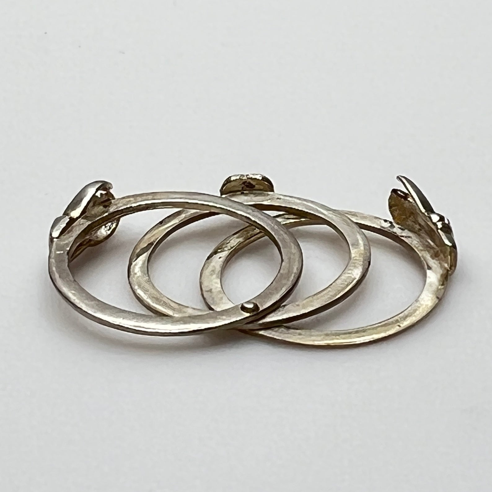 Open view of 3-part sterling silver Claddagh ring showing hands and heart