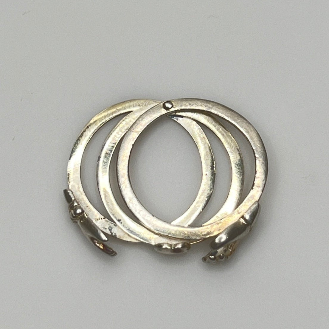 Open view of 3-part sterling silver Claddagh ring showing hands and heart