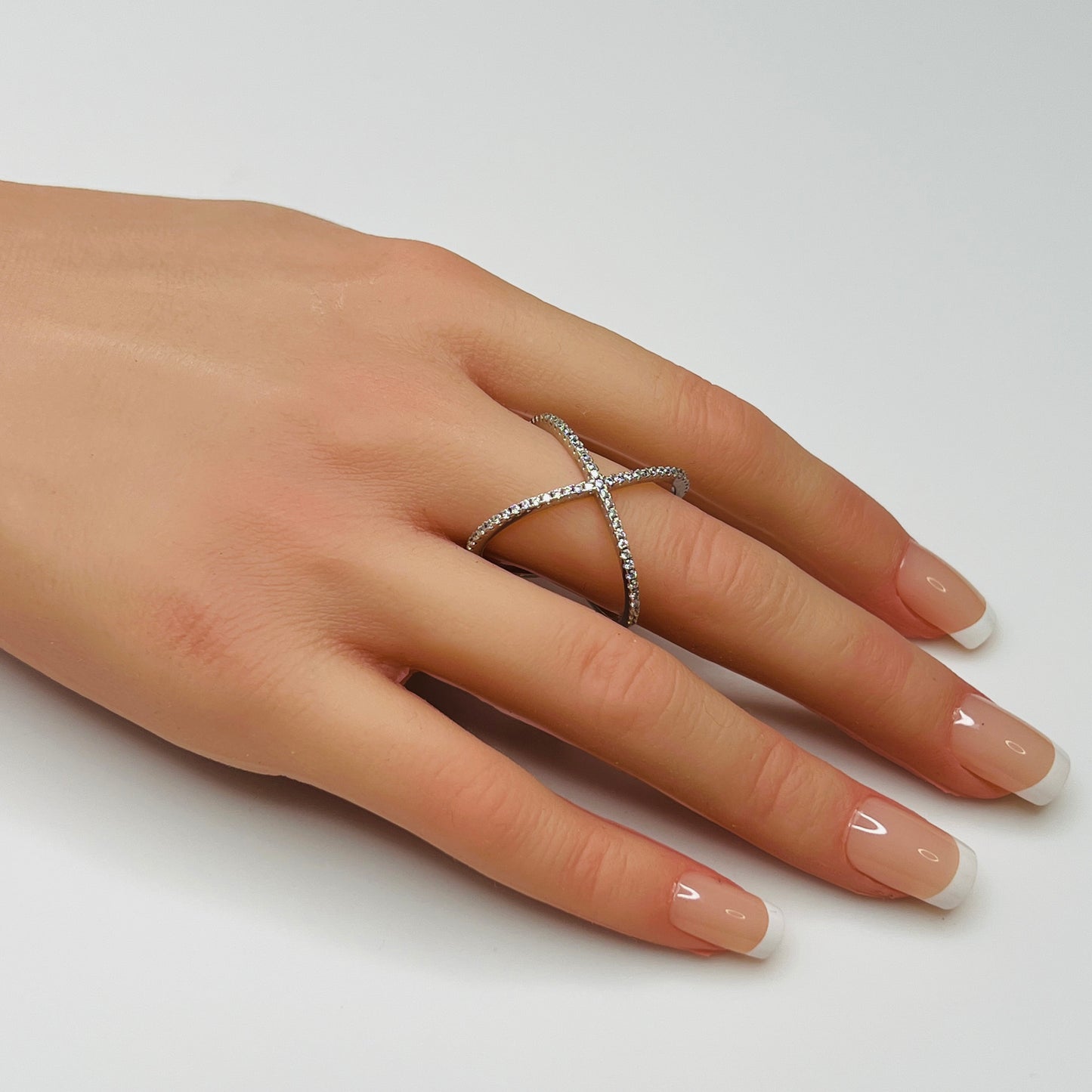 Sterling silver criss-cross ring with pavé CZs on hand, size 8