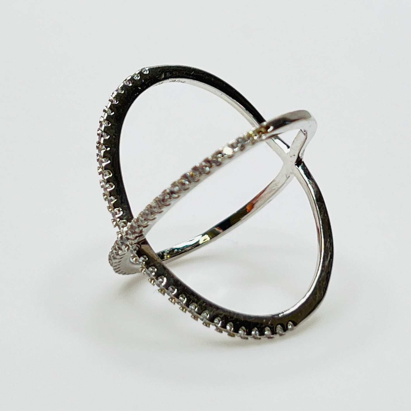 Detail of intersecting pavé CZ bands on silver ring