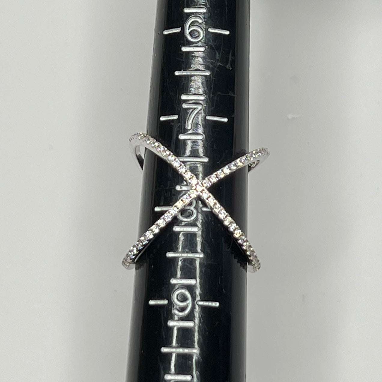 Detail of intersecting pavé CZ bands on silver ring