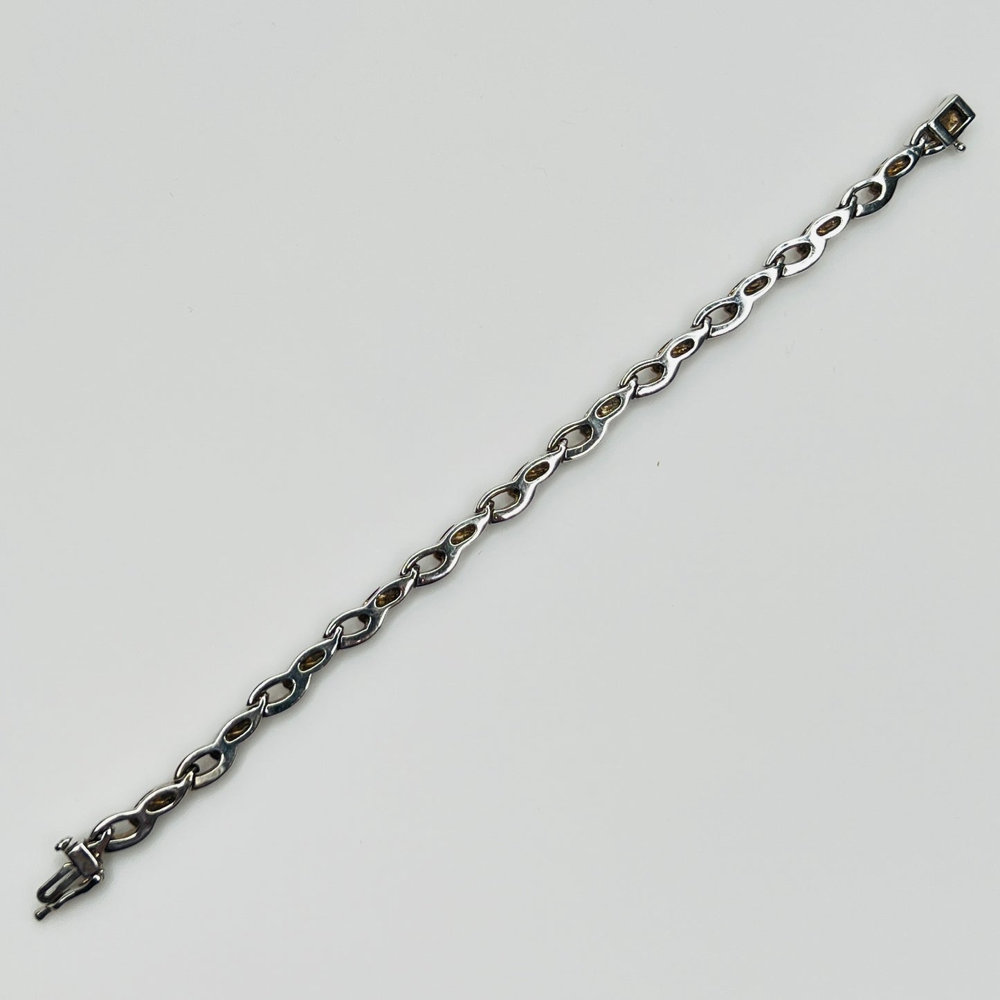 Reverse view of vintage JBCO bracelet showing smooth silver backing