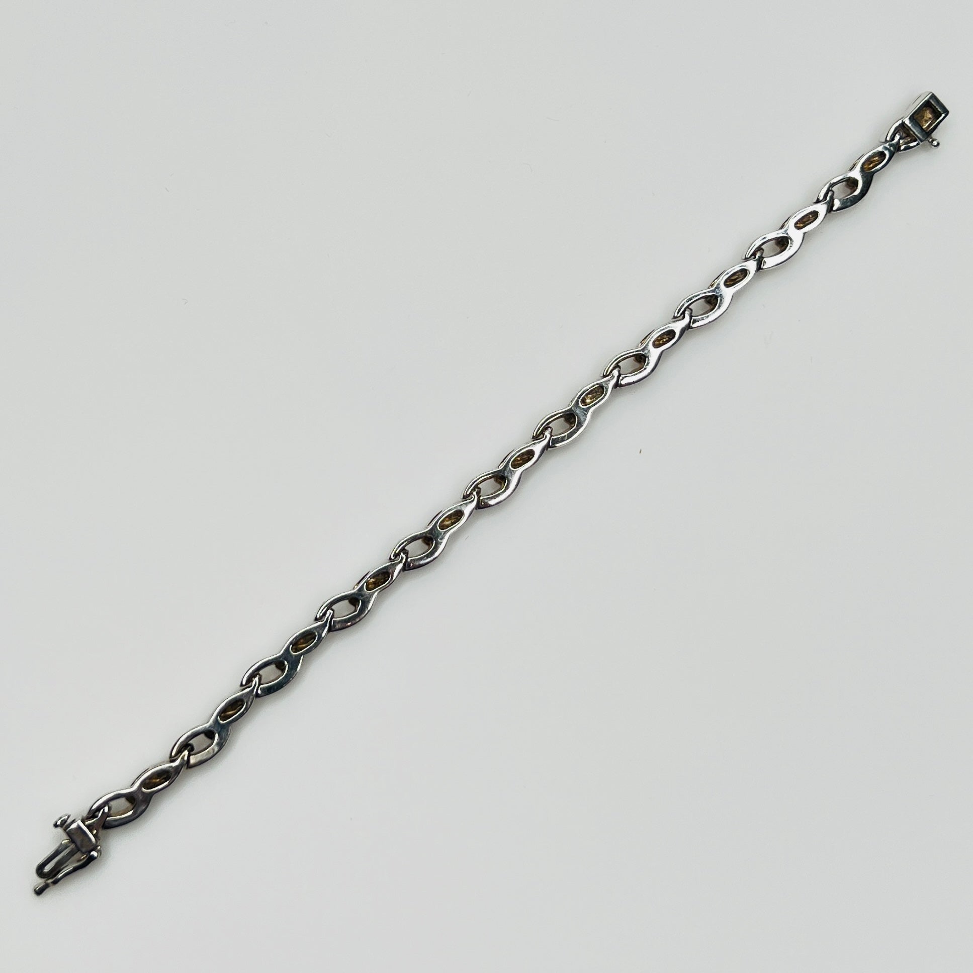 Reverse view of vintage JBCO bracelet showing smooth silver backing
