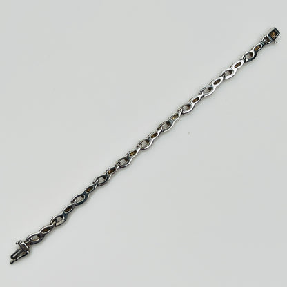 Reverse view of vintage JBCO bracelet showing smooth silver backing