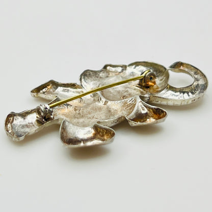 Back view of sterling silver elephant brooch showing rollover clasp and vintage patina