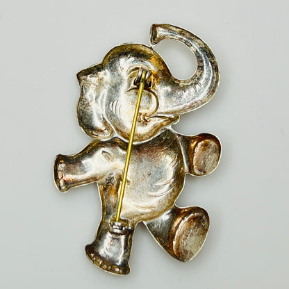 Back view of sterling silver elephant brooch showing rollover clasp and vintage patina