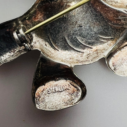 Close-up of sterling hallmark on reverse of vintage elephant brooch