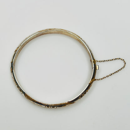 Vintage sterling silver hinged bangle with etched floral scroll design