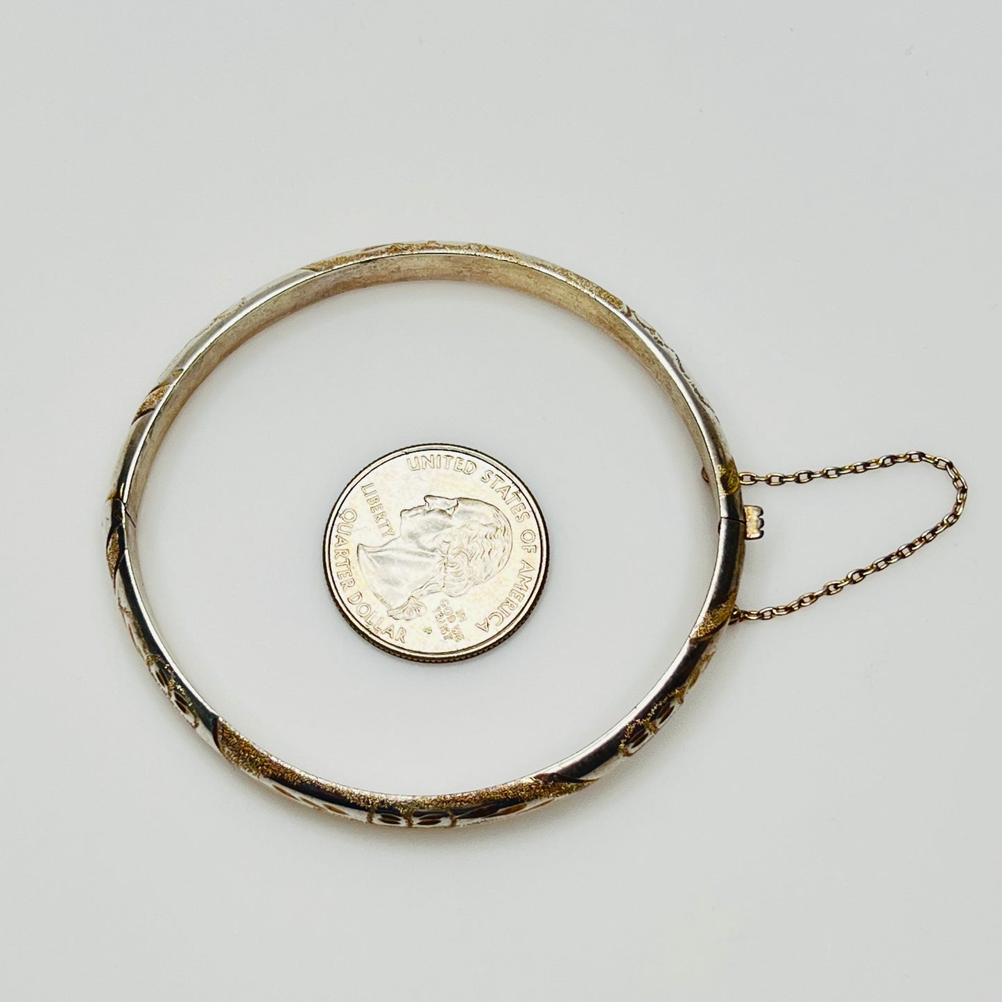 Vintage sterling silver hinged bangle with etched floral scroll design