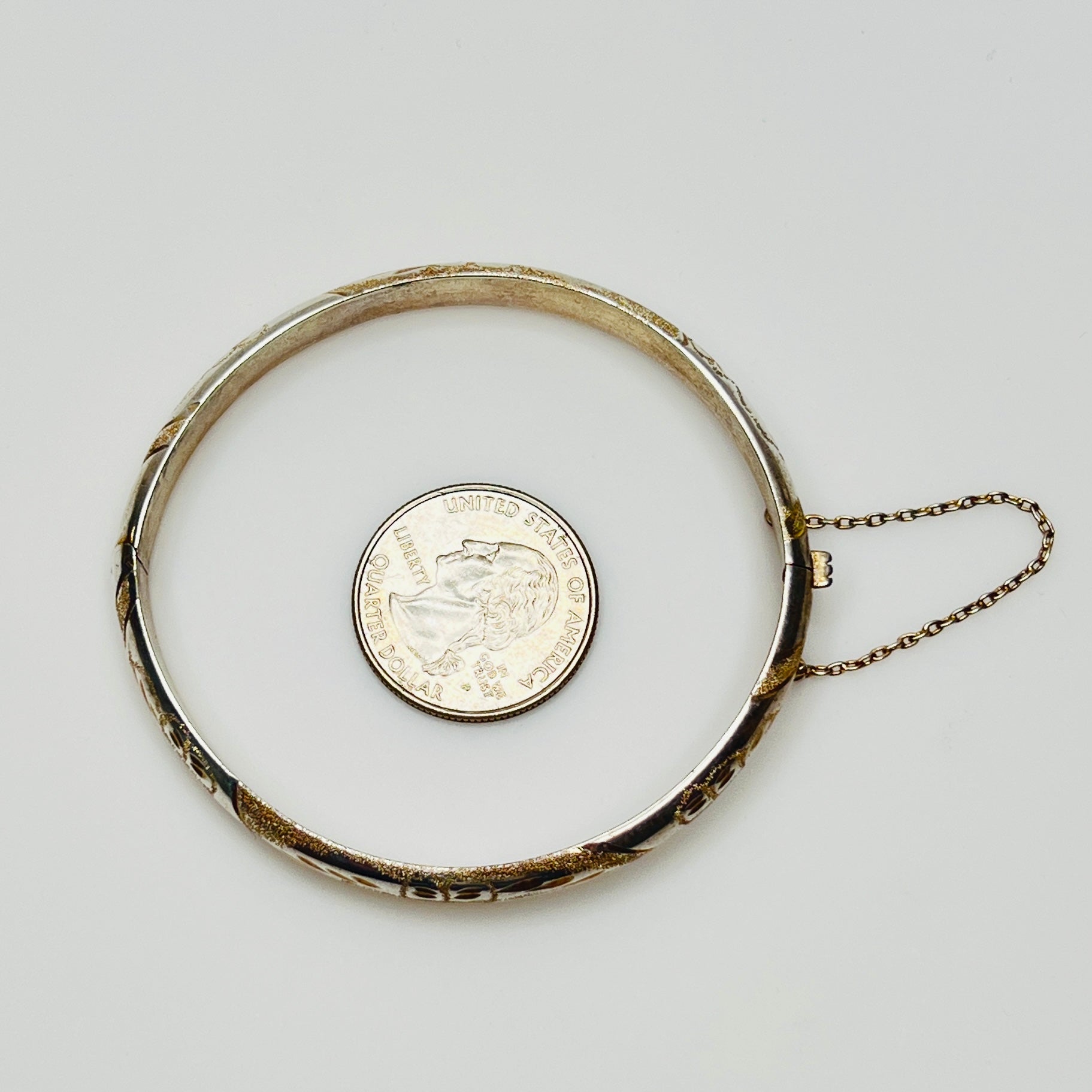 Vintage sterling silver hinged bangle with etched floral scroll design