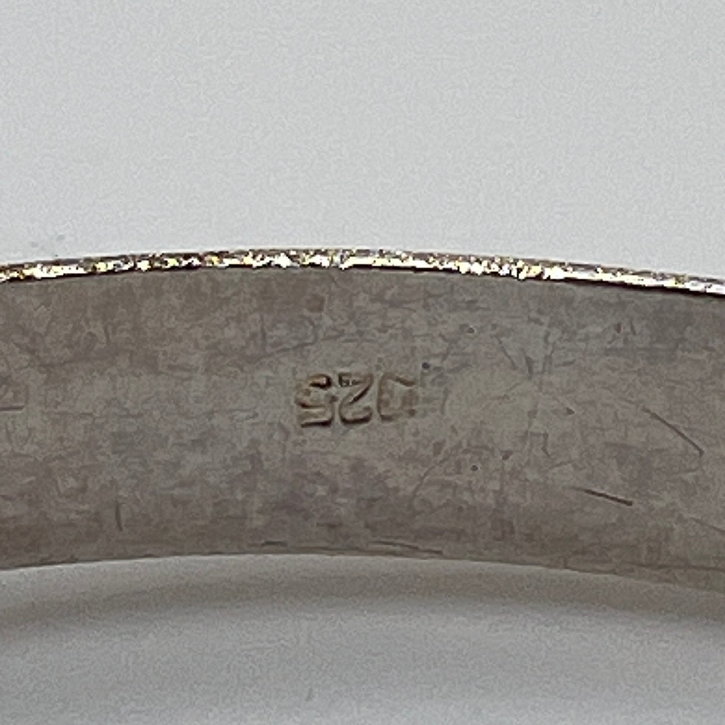 Vintage sterling silver hinged bangle with etched floral scroll design