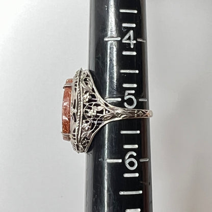 Statement vintage ring with ornate sterling floral filigree and oval goldstone