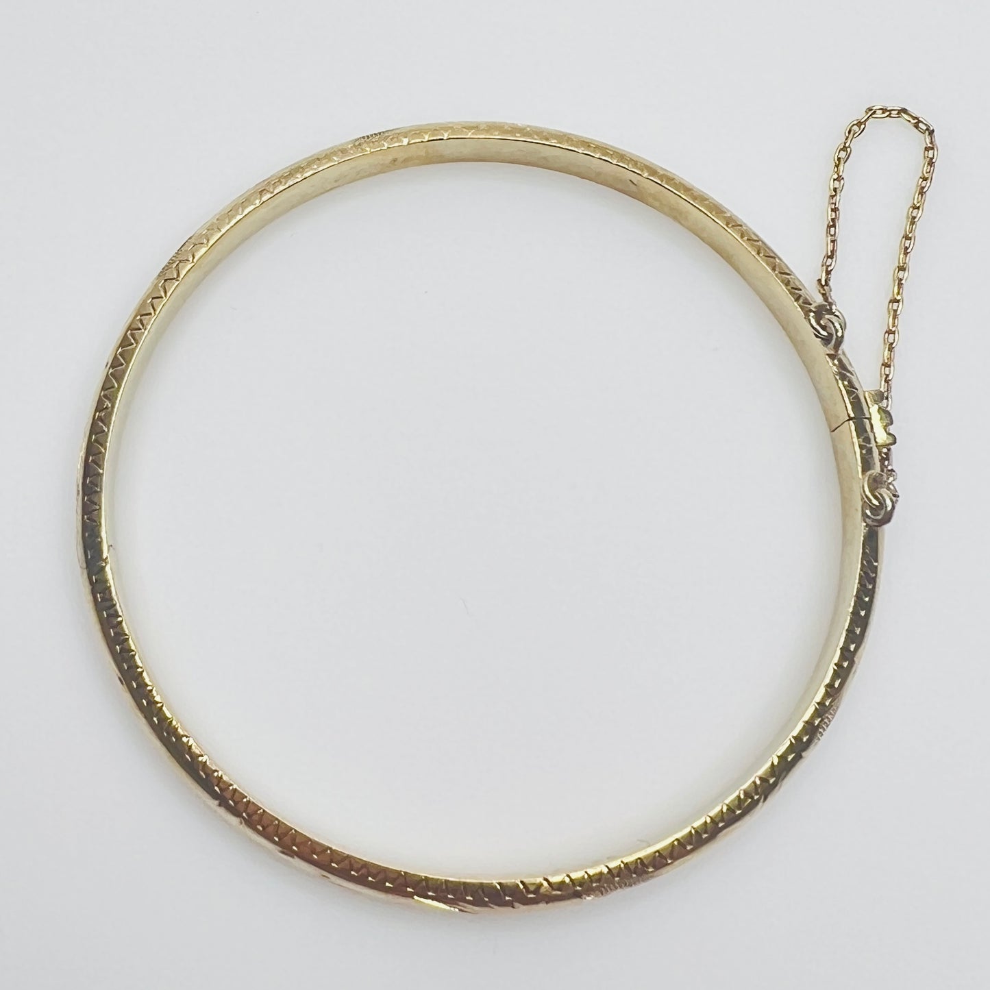 Gold vermeil etched bangle bracelet with floral design