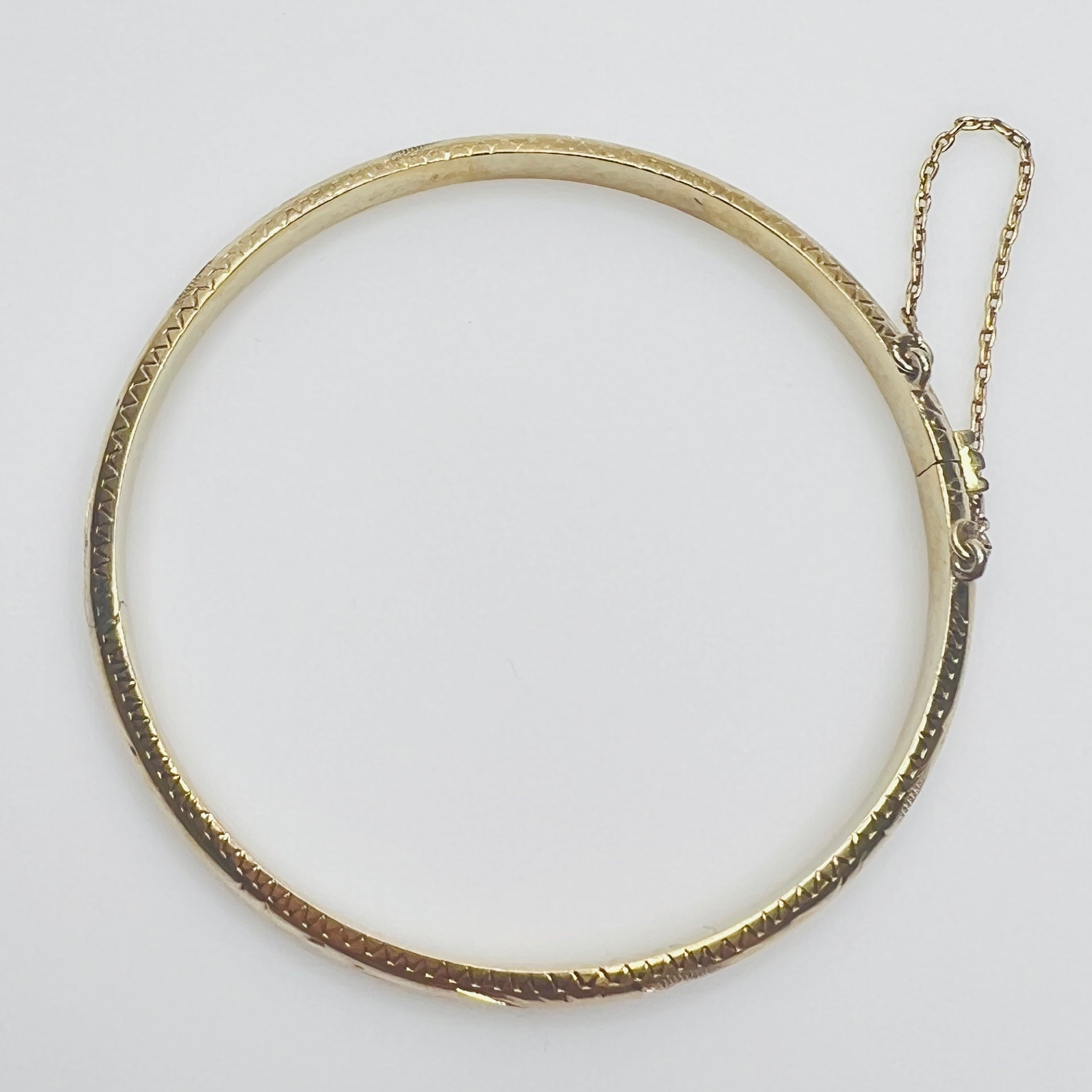 Gold vermeil etched bangle bracelet with floral design