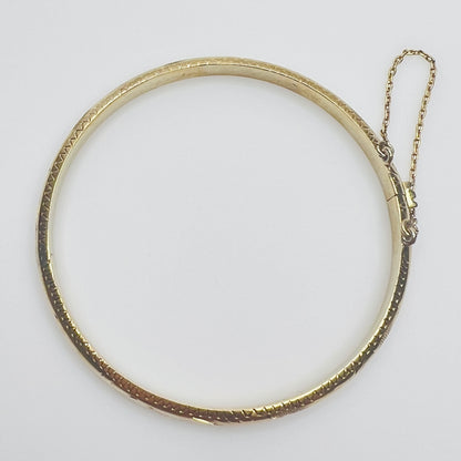 Gold vermeil etched bangle bracelet with floral design