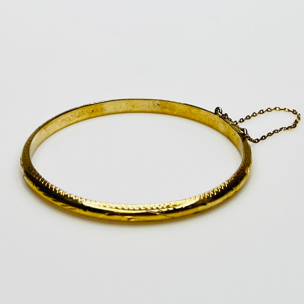 Gold vermeil etched bangle bracelet with floral design